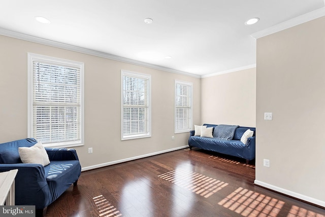 sitting room with dark hardwood / wood-style flooring and crown molding