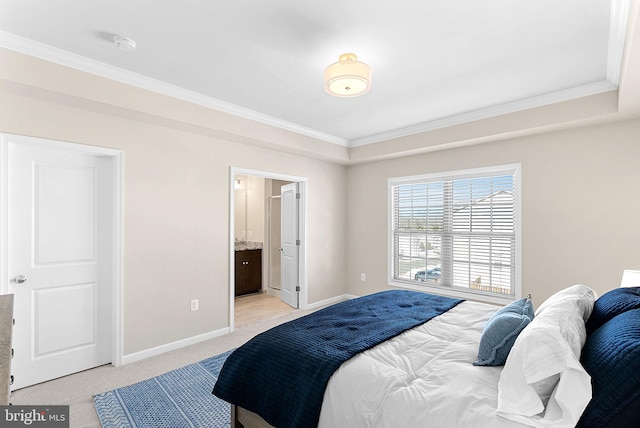 bedroom with ensuite bath, ornamental molding, and light carpet