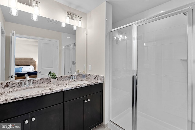 bathroom with vanity and walk in shower