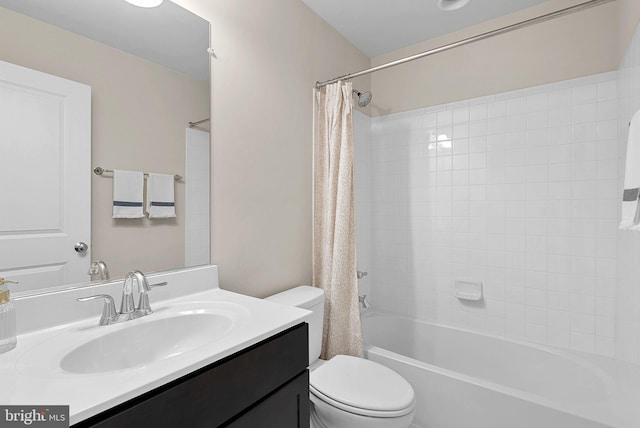 full bathroom featuring shower / tub combo, vanity, and toilet