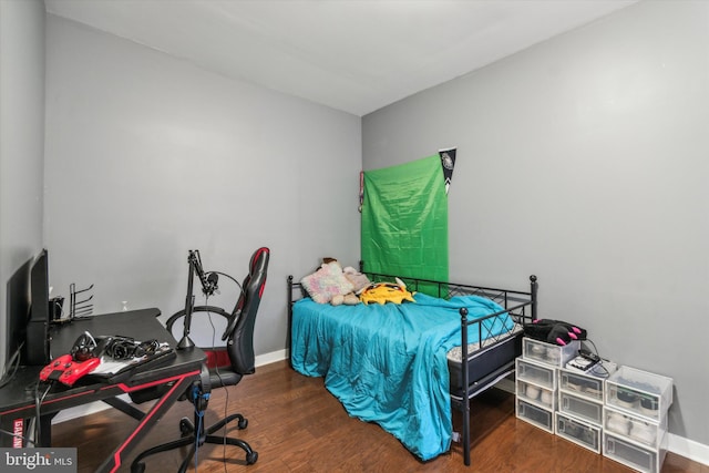 bedroom featuring dark hardwood / wood-style flooring