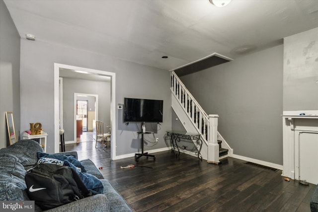 living room with dark hardwood / wood-style floors