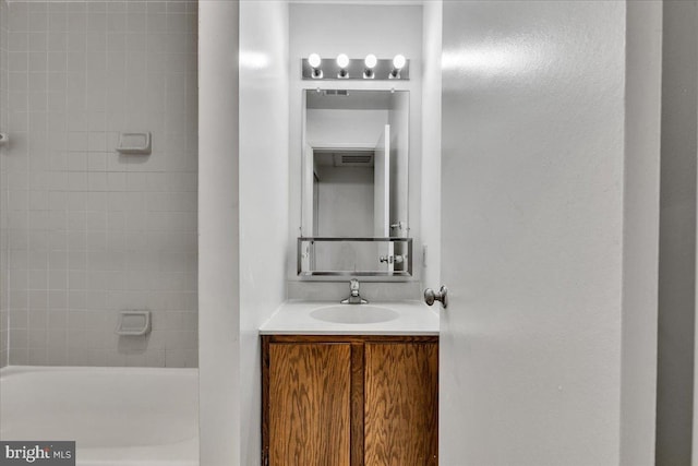 bathroom with vanity and a tub to relax in