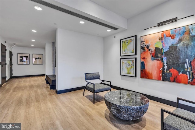 sitting room featuring light hardwood / wood-style floors