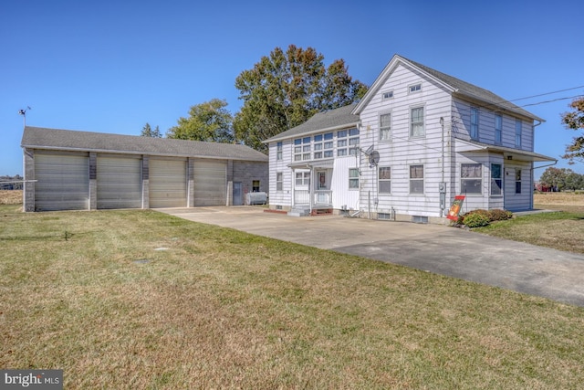 exterior space featuring a front yard and a garage