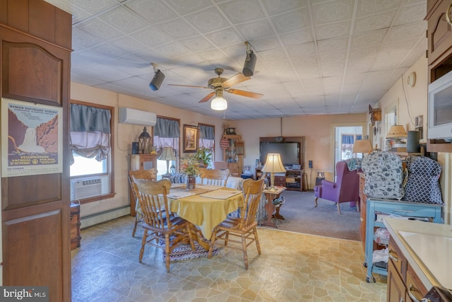 carpeted dining area featuring cooling unit, a wall mounted AC, a baseboard radiator, and ceiling fan