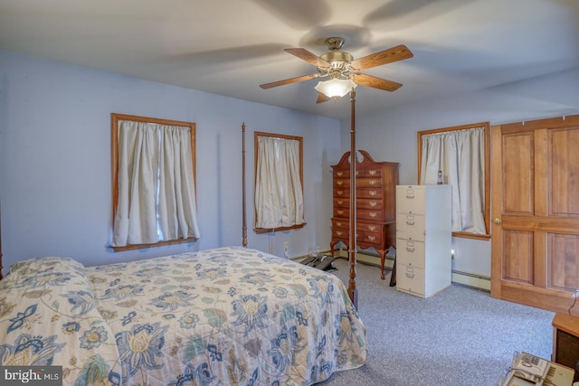 carpeted bedroom with a baseboard radiator and ceiling fan