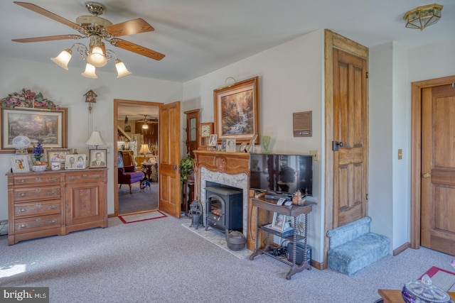 living room featuring light carpet and ceiling fan