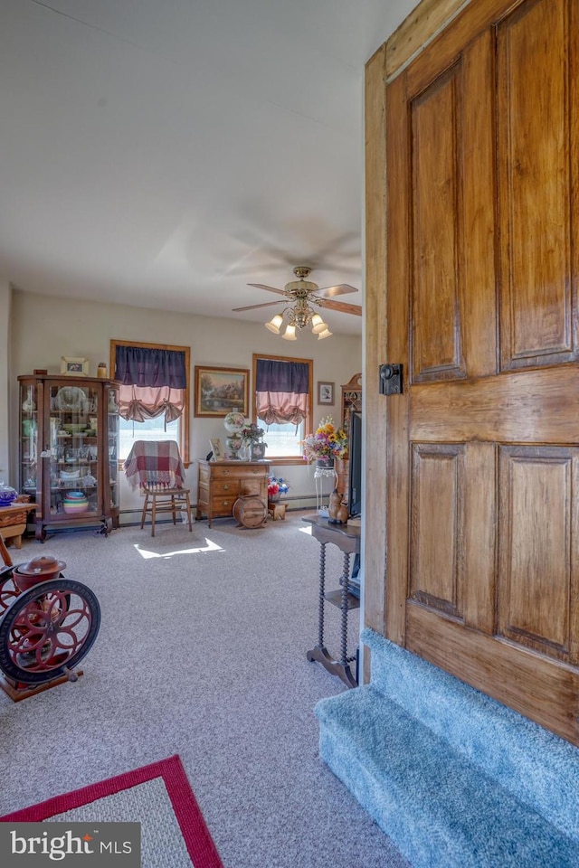 living room featuring carpet flooring and ceiling fan