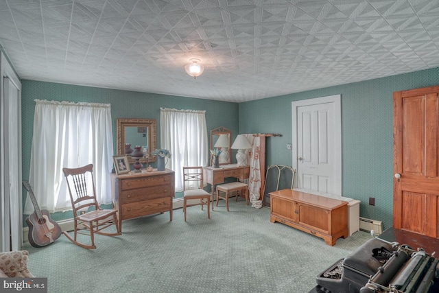 sitting room with carpet flooring and a baseboard radiator