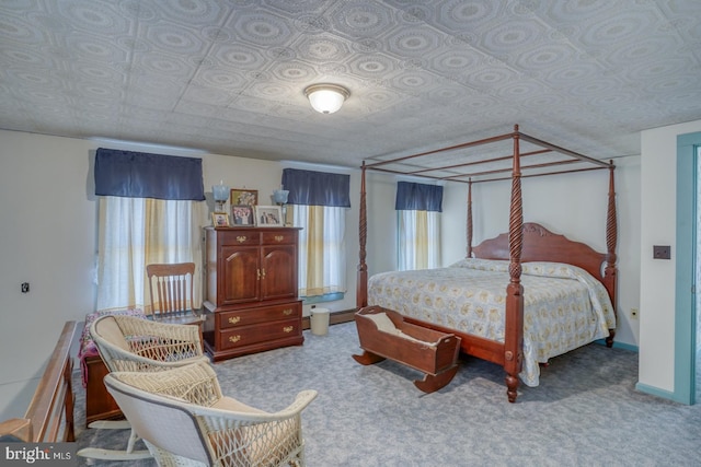 bedroom featuring light carpet