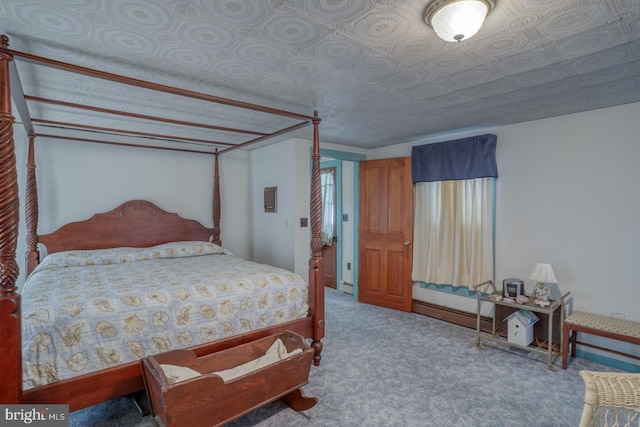 bedroom featuring baseboard heating and light carpet