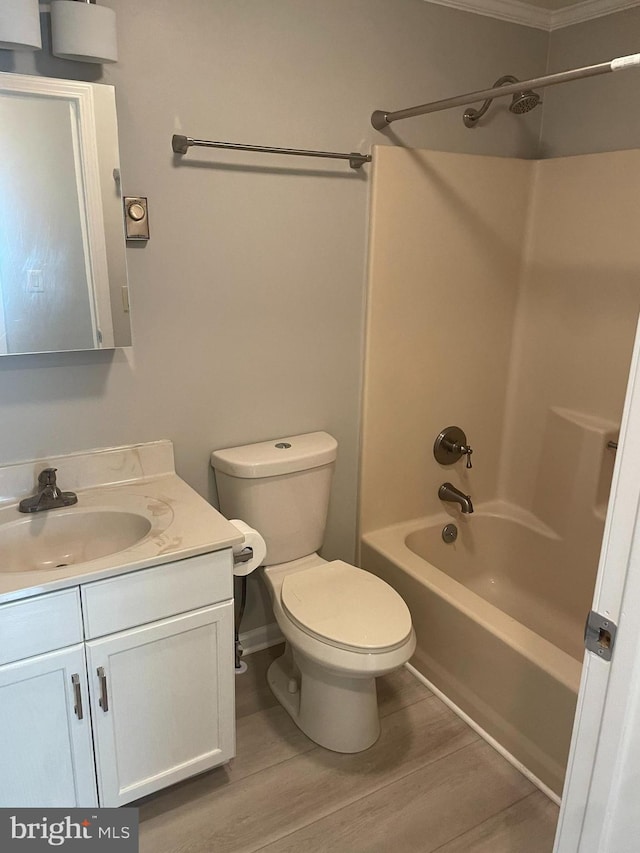 full bathroom with vanity, hardwood / wood-style floors, toilet, and shower / bath combination