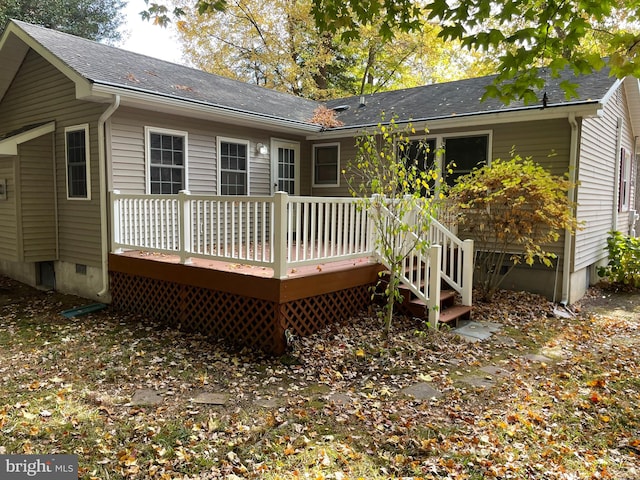 rear view of house featuring a deck