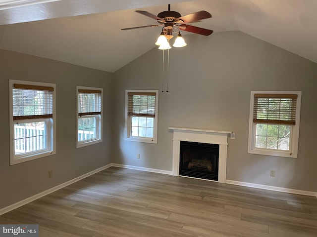 unfurnished living room featuring light hardwood / wood-style flooring and a wealth of natural light