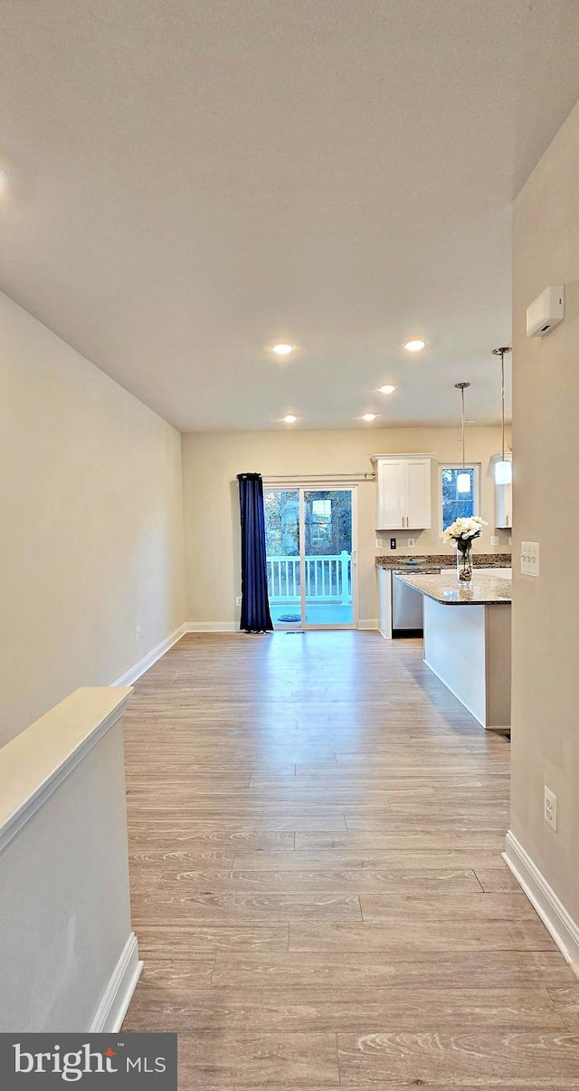 unfurnished living room featuring light hardwood / wood-style floors