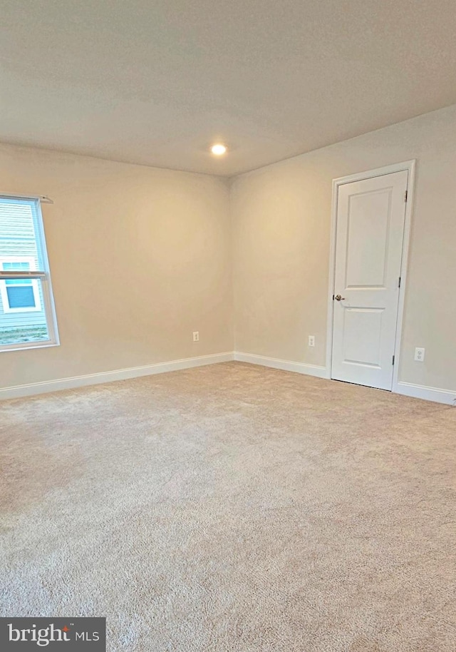 unfurnished room featuring carpet floors