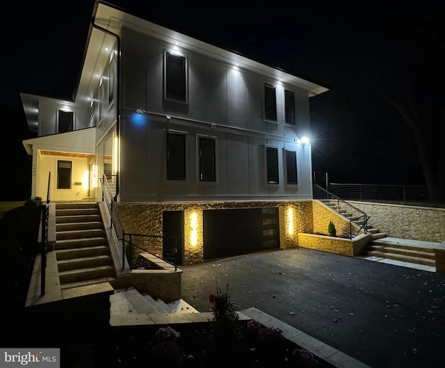 5005 Ravensworth Rd, Annandale, VA 22003 - view of front of house featuring stairs, driveway, and a garage