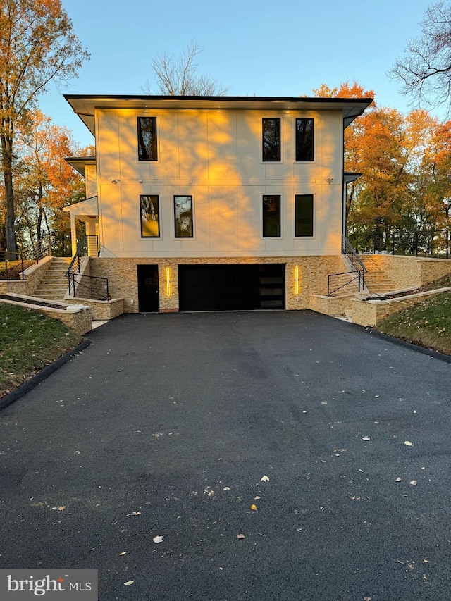 view of side of home featuring a garage