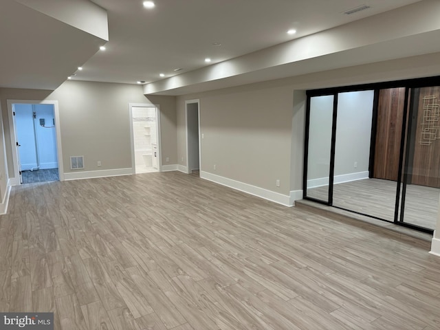 basement featuring light wood-type flooring