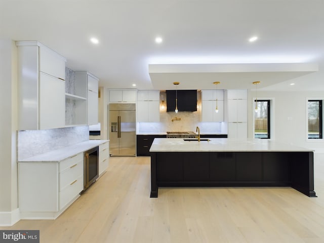5005 Ravensworth Rd, Annandale, VA 22003 - kitchen with built in refrigerator, beverage cooler, white cabinets, backsplash, and recessed lighting