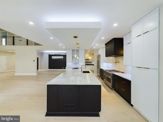5005 Ravensworth Rd, Annandale, VA 22003 - kitchen featuring high quality appliances, recessed lighting, white cabinets, dark cabinetry, and backsplash