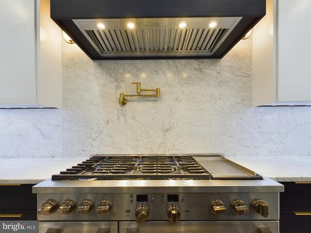 5005 Ravensworth Rd, Annandale, VA 22003 - kitchen view of exhaust hood, high end stainless steel range oven, decorative backsplash, and pot filler