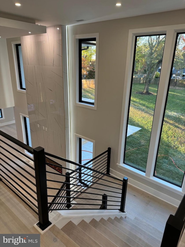 stairway featuring hardwood / wood-style floors