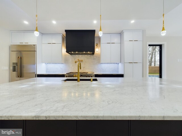 5005 Ravensworth Rd, Annandale, VA 22003 - kitchen featuring high quality fridge, custom range hood, recessed lighting, modern cabinets, and light stone counters