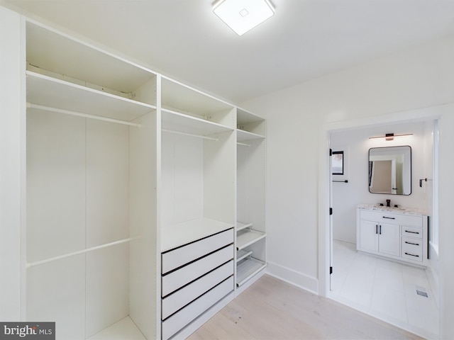 5005 Ravensworth Rd, Annandale, VA 22003 - spacious closet featuring a sink and light wood-style floors