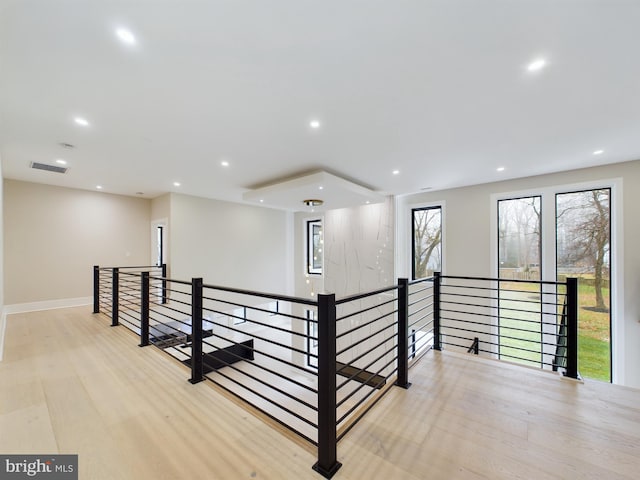 hall with light hardwood / wood-style flooring