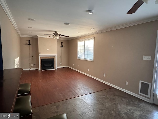 unfurnished living room featuring ceiling fan, a fireplace, dark hardwood / wood-style floors, and ornamental molding