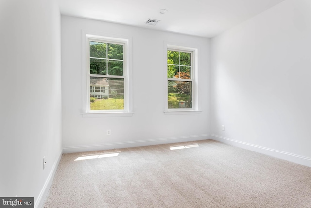 unfurnished room with carpet floors