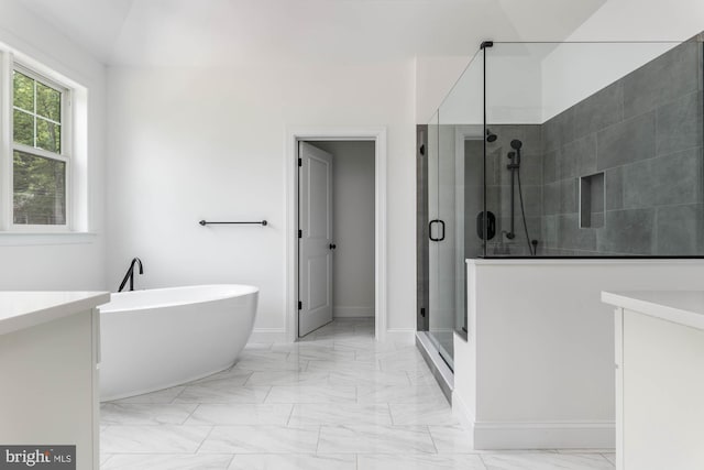 bathroom featuring vanity and shower with separate bathtub