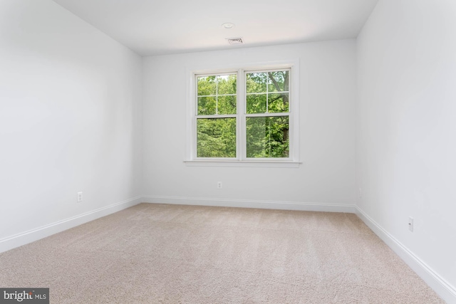 empty room with carpet flooring