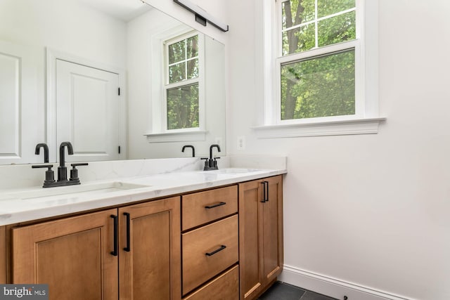 bathroom featuring vanity, plenty of natural light, and tile patterned flooring