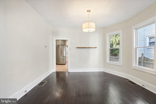 empty room featuring dark hardwood / wood-style floors