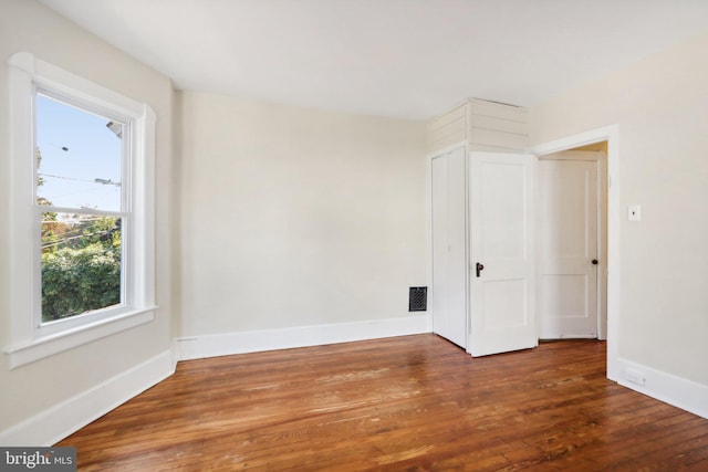 unfurnished room featuring wood-type flooring