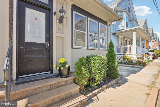 property entrance featuring covered porch