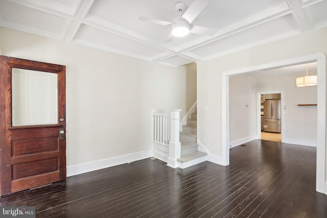 unfurnished room featuring beamed ceiling, coffered ceiling, ceiling fan, and dark hardwood / wood-style flooring