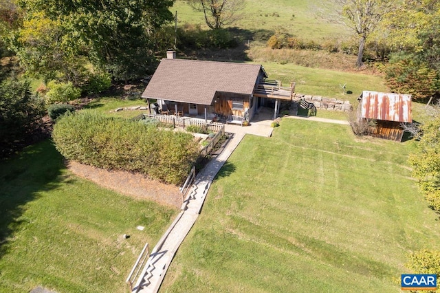 birds eye view of property with a rural view