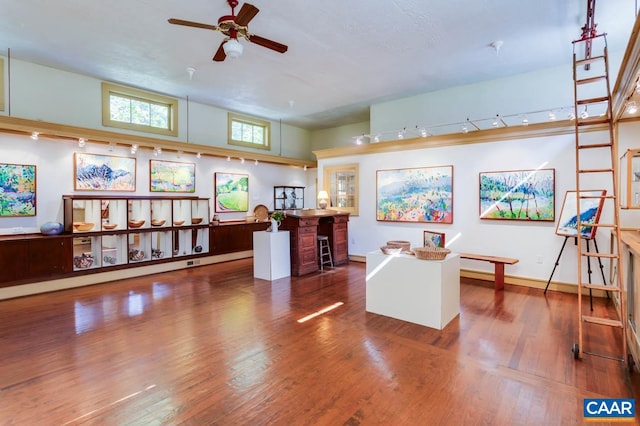 interior space featuring hardwood / wood-style floors and ceiling fan