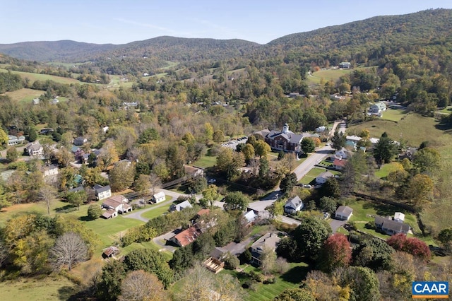 birds eye view of property with a mountain view