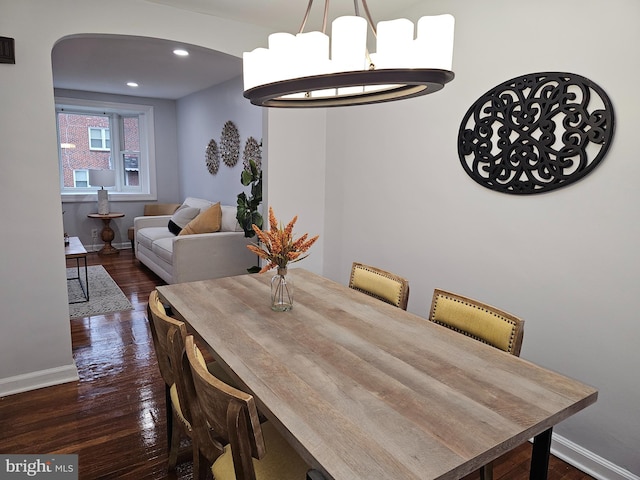 dining room with dark hardwood / wood-style flooring