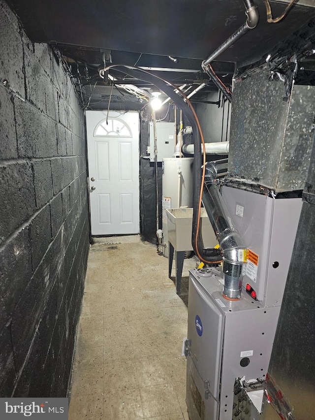 utility room with gas water heater