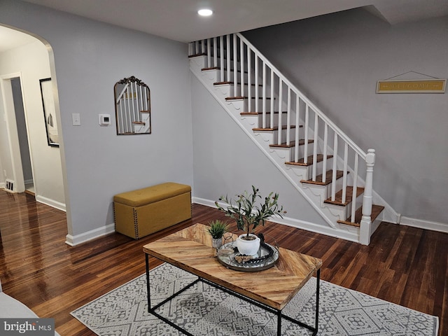 living room with dark hardwood / wood-style floors