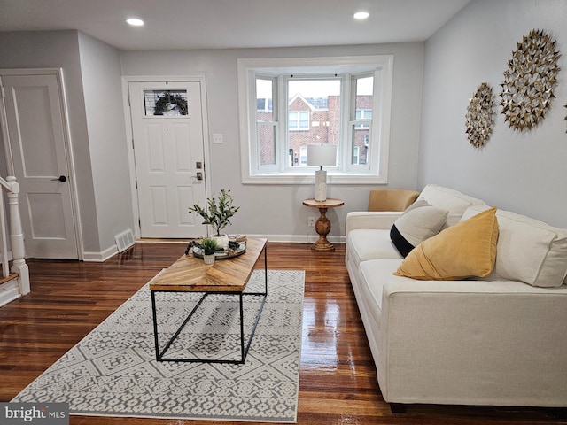 living room featuring dark hardwood / wood-style flooring