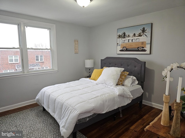 bedroom featuring dark hardwood / wood-style flooring