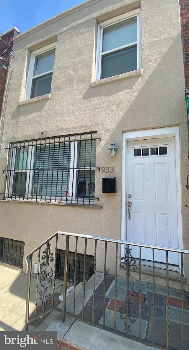 view of exterior entry with a garage