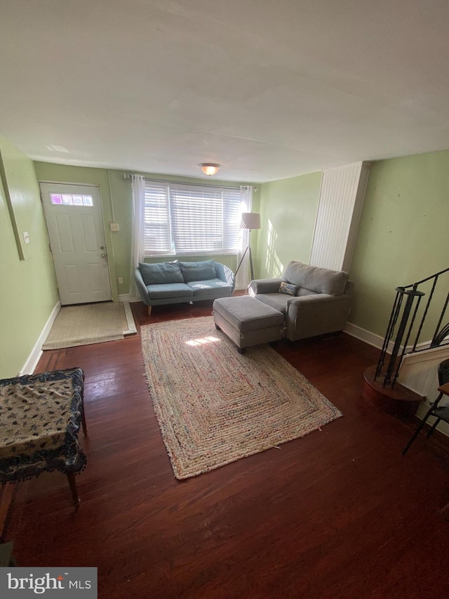 living room featuring dark wood-type flooring